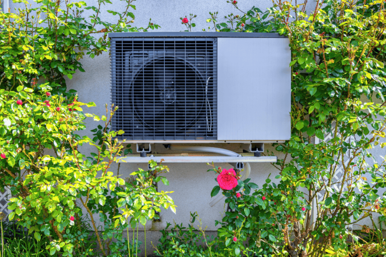 hvac unit oudoors surrounded by greenery